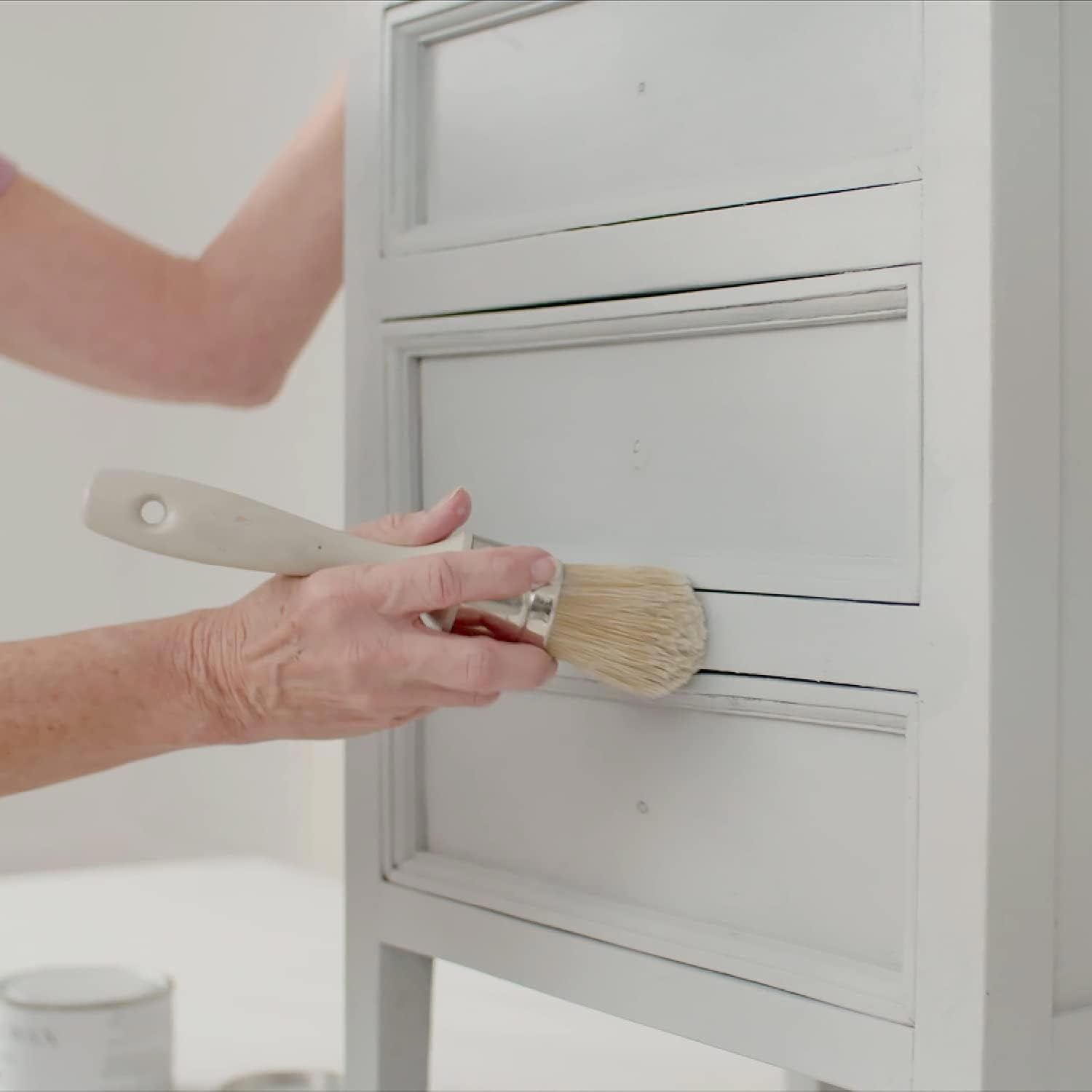 A Person Applying Wax to Furniture