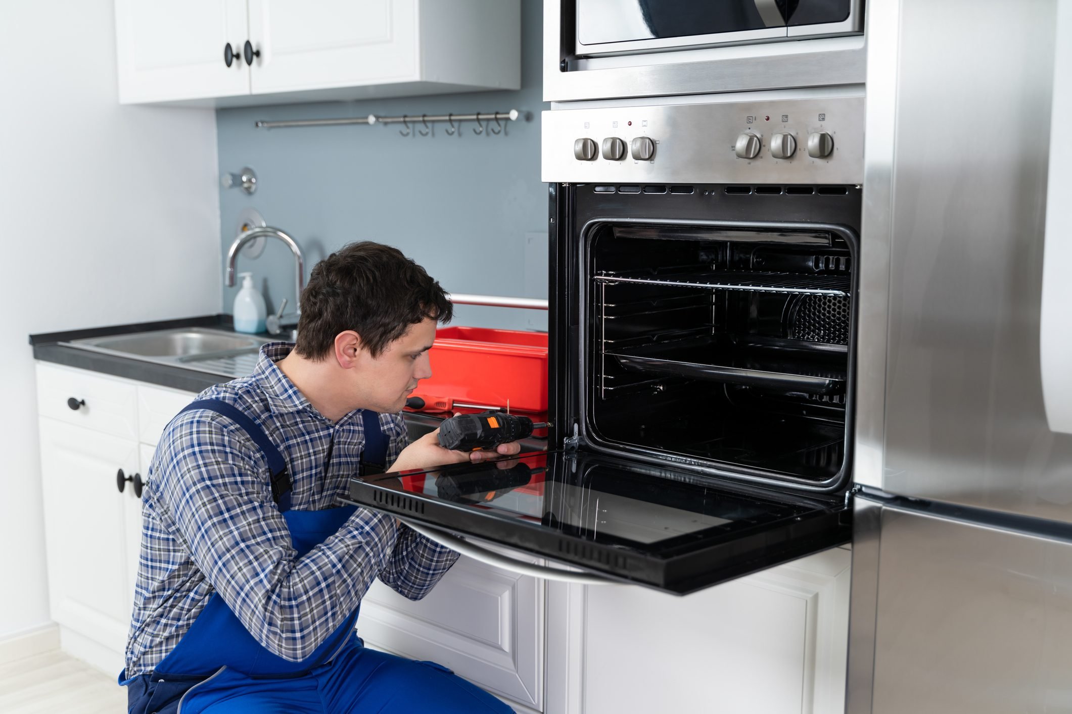Technician Installing Oven