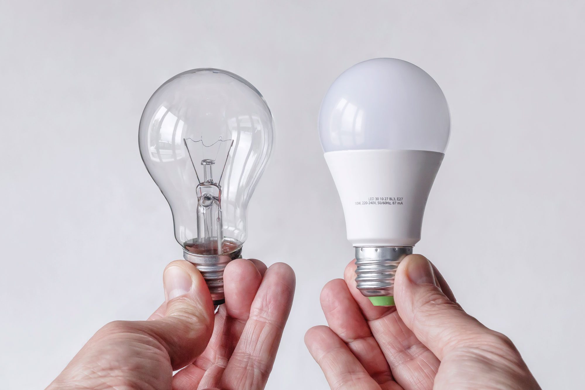 Incandescent Light Bulb And Led Lamp Being Compared Side By Side