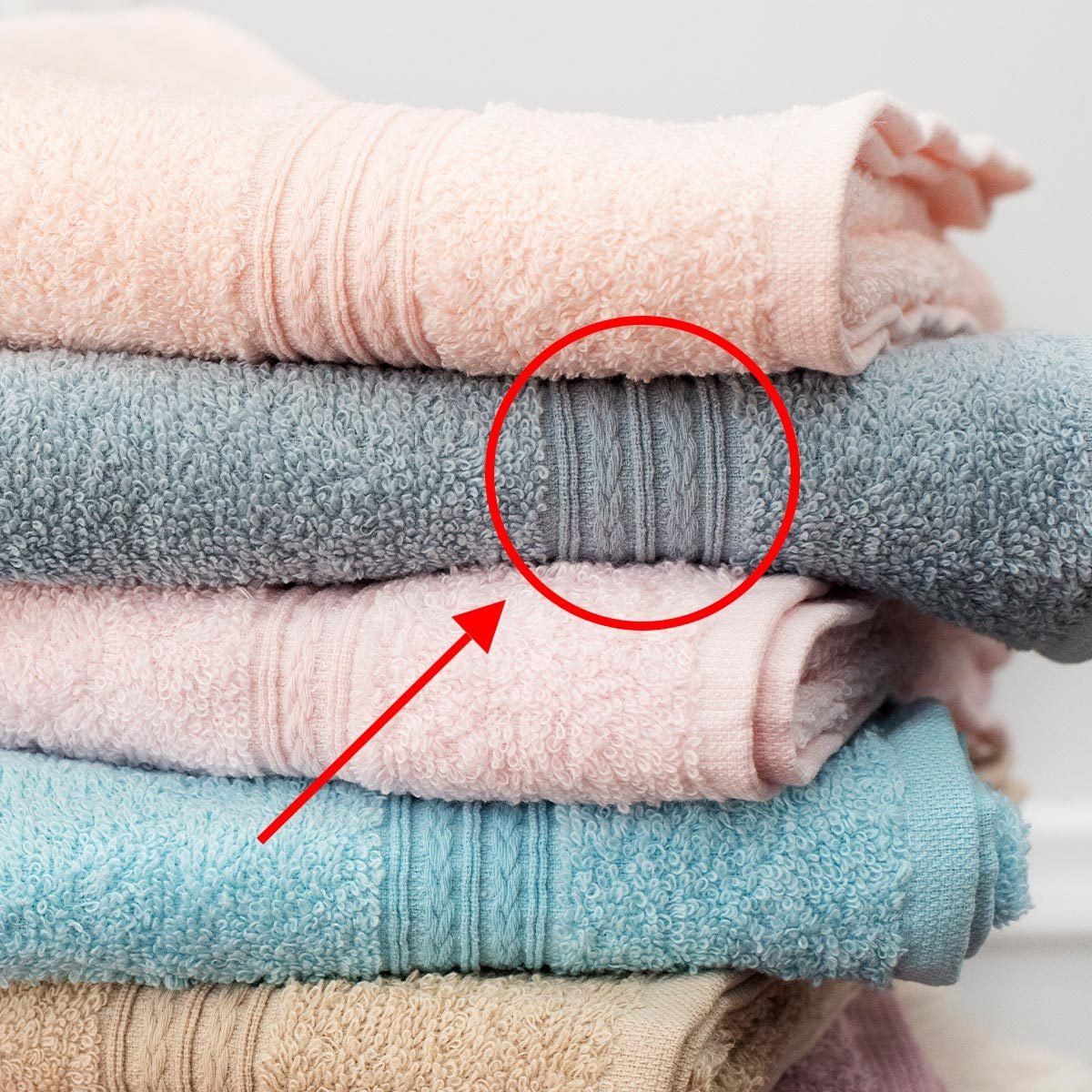 Do You Know What That Strip at the Bottom of Bath Towels Is For?